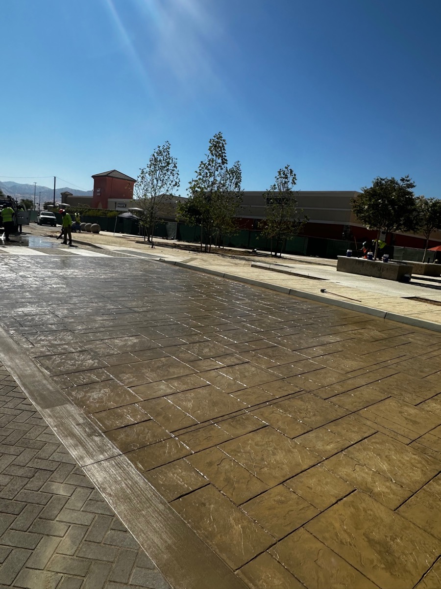 Tan stamped decorative concrete in a herringbone pattern